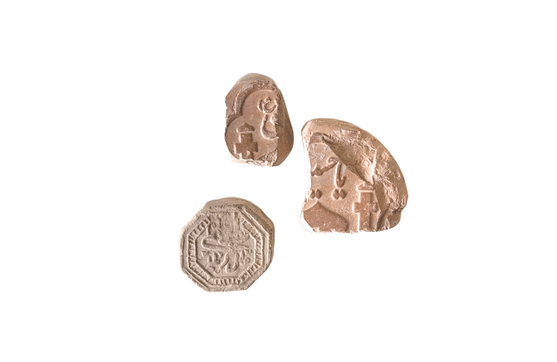 Three turbah tablets of soil, used in Shia prayer