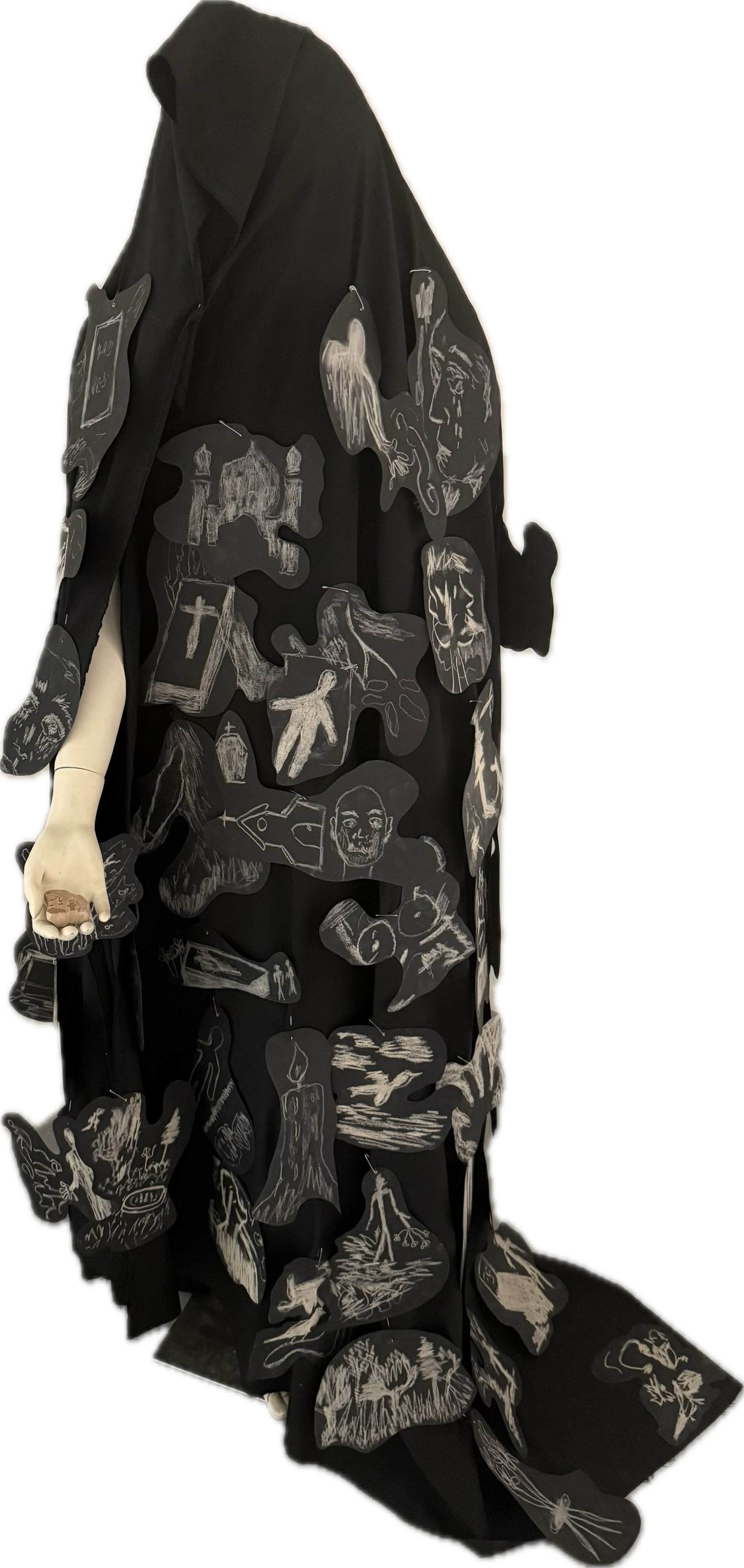 Mannequin dressed in black fabric covered with black drawings for Radaye Siah